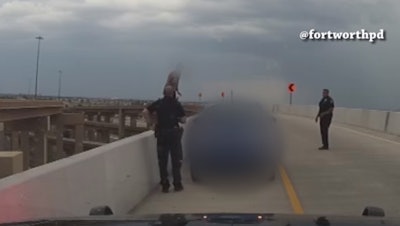 Two officers with the Fort Worth (TX) Police Department recently rescued a suicidal woman who was standing precariously atop the safety barrier on a very high highway bridge. The department wisely held a press event to tell their story.