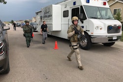 Officers rush to arrest a man who reportedly opened fire on officers and briefly held two people hostage. Image courtesy of Pennington County Sheriff's Office / Facebook.