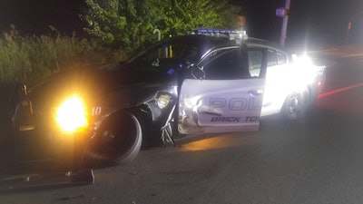 An officer with the Brick Township (NJ) Police Department was assisting with an investigation of a motor vehicle accident when a suspected drunk driver slammed into her parked squad car. Image courtesy of Brick Township PD / Facebook.