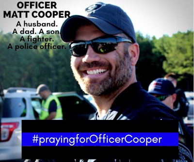 Officer Matt Cooper is listed in serious condition with a bullet lodged at his Carotid artery. Image courtesy of Covington PD / Facebook.