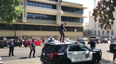 Lopez was arrested last month for stomping on top of a Fresno police SUV, smashing in the roof, and kicking out its windows in front of police headquarters in downtown Fresno. (Photo: Fresno Bee)