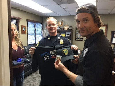 McConaughey teamed up with Wild Turkey to serve officers turkeys and bourbon and thanked them for their services during Hurricane Harvey. Photo: Houston PD / Twitter