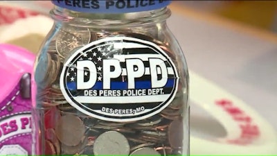 Des Peres Department of Public Safety Detective Trent Koppel asked members of the department to help fill two new tip jars to replace those stolen from two local kids. Image courtesy of Des Peres Department of Public Safety.