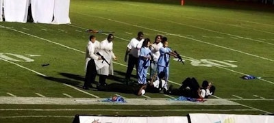 Images of students from the Forest Hill (MS) High School marching band's performance during a game against Brookhaven High School depicting the murder of police officers. Image courtesy of Mayor Joe Cox / Facebook.