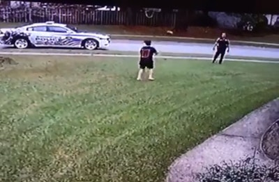 A 10-year-old boy was tossing a football to himself when an officer with the Summerville (SC) Police Department stopped his patrol vehicle and asked him if he had anyone to play with. Image courtesy of Summerville PD / Facebook.