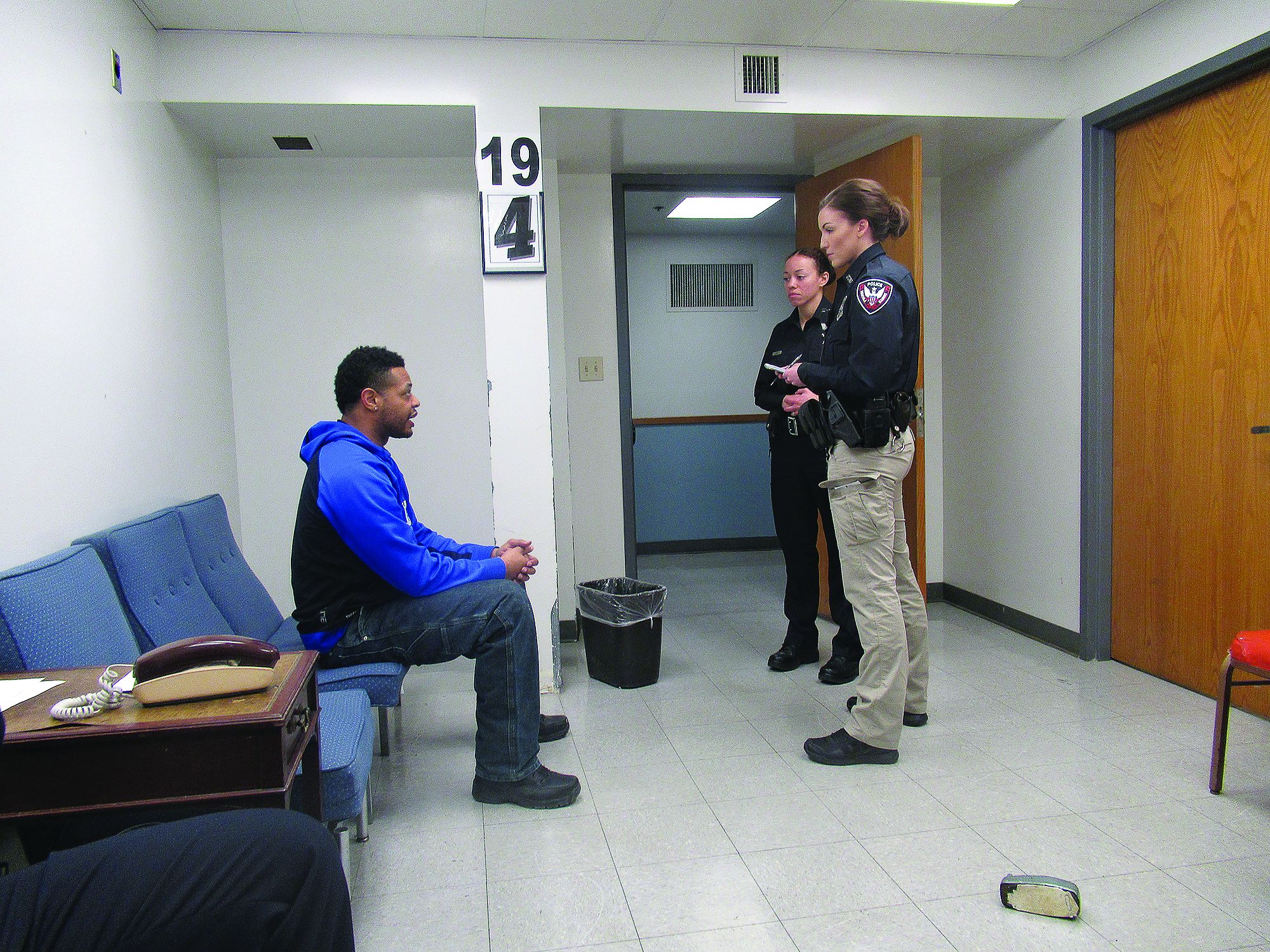 Once the parties have been separated, interview everyone involved. Do so from a safe distance, with your hands above your waist and weapon side back. (Photo: Michael Schlosser)