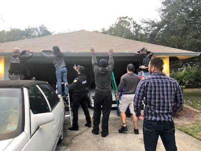 Officers with the Orlando (FL) Police Department visited the home of Officer Kevin Valencia to deliver some Christmas Cheer. Image courtesy of Orlando PD / Facebook.