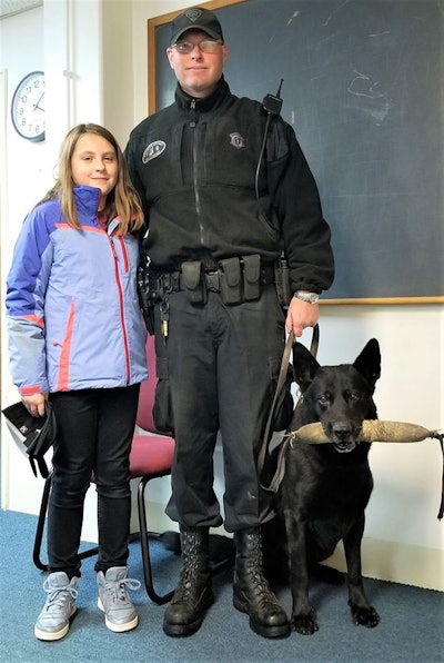 Olivia Feil bought treats for K-9 Tank and met the dog and his handler Trooper Thomas Janeczak. (Photo: Massachusetts State Police/Facebook)