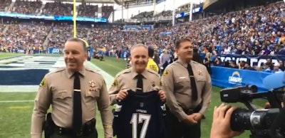 Screen grab of video showing reserve deputies with the Los Angeles County Sheriff's Department being honored prior to the contest between the Los Angeles Chargers and the Cincinnati Bengals of the NFL.