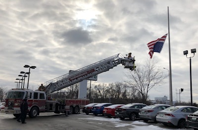 An officer with the Independence (MO) Police Department was on patrol when he noticed that the top part of an American flag had come apart from the flag pole it was flying from, rendering the stars and stripes to fly upside down.