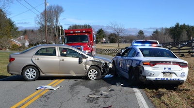 An officer with the Galax (VA) Police Department was reportedly injured when a passing Toyota Camry slammed into his squad car during a traffic stop on Saturday morning.