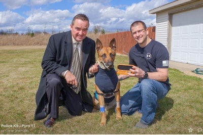 Green Bay Mayor Jim Schmitt presents K-9 Pyro and his handler—Officer Scott Salzmann—with a very rare 'Key to the City' for his heroic action and for his service to the Green Bay community.
