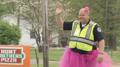 Lebanon Junction, KY, Police Chief Terry Phillips told the school's archery class if the students could raise their target score up to 200, he would wear a dress or tutu while outside directing traffic.