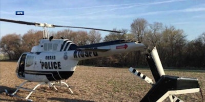 An Omaha Police helicopter made a rough landing after mechanical failure Tuesday. No one was injured. (Photo: KETV screen shot)