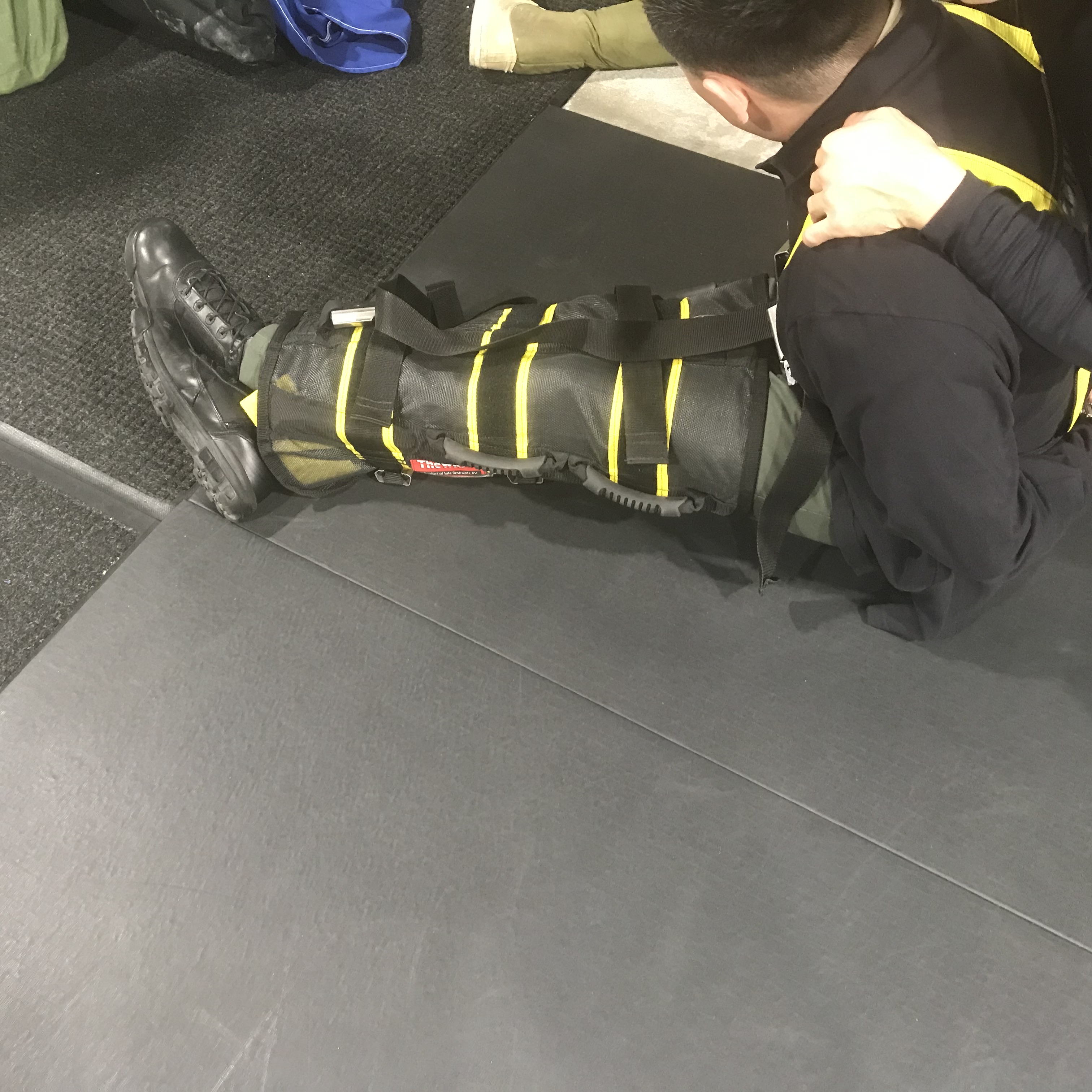 LASD tests many less-lethal products. The Wrap from Safe Restraints prevents subjects from moving their legs or arms.