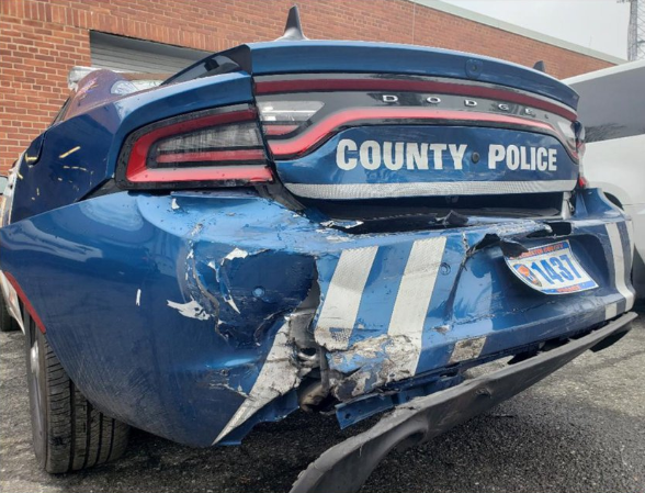 According to the Westchester Journal News, a 24-year-old woman—who has not yet been named—was driving a Chevy Impala when she slammed into the back of the patrol car on a local freeway.