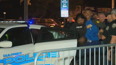 Darian Tawan Atkinson, 19, is delivered to Biloxi Police headquarters. Atkinson faces a charge of capital murder in the killing of Biloxi Officer Robert McKeithen. (Photo: WLOX Screen Shot)