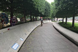 That's me, walking the wall early on my first day in DC for National Police Week. I was on the ground in DC for four days, and visited the Police Memorial Wall nine times. It's fascinating to see how it changes over time as new mementos are left by family and friends of officers who were killed in the line of duty over the years.