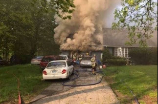 Shelton, CT, police officer Michael Kichar saved two people from this house fire. (Photo: Shelton Fire Department)