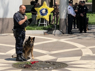 Officer and K-9 partner at last year's Police K-9 Memorial Service. (Photo: National Police Dog Foundation)