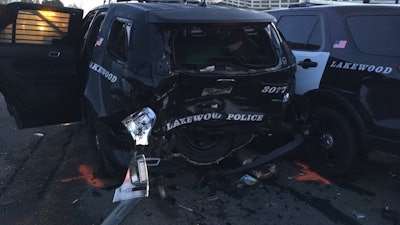 An allegedly drunk driver crashed into this Lakewood, CO, police vehicle Saturday, injuring an officer and a DUI suspect who was being arrested. (Photo: Lakewood PD)