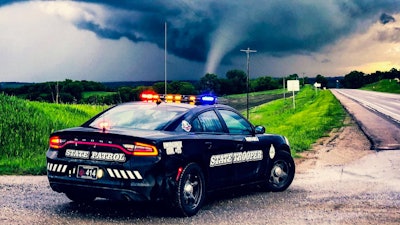 The Nebraska Highway Patrol posted an image to its Facebook page with the caption, 'This tornado crossed Highway 75 just south of Dawson tonight in Richardson County. ‪Trooper Zost had this incredible view. ‪He reports it stayed in a field so not likely much damage to structures, if any. '