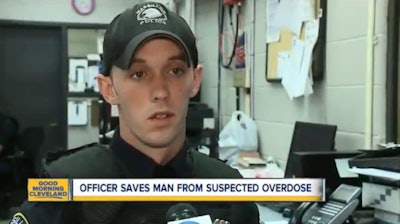 Officer Aaron Franklin freed six teens trapped in a storm drain being filled with rushing waters form a local creek. A short time later, he came upon an unconscious man who had crashed his truck into two cars; the officer administered Narcan, and then performed CPR. (Photo: ABC News Screen Shot)