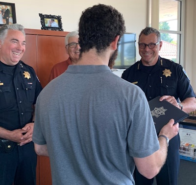 The Santa Cruz (CA) Police Department has awarded an anonymous Good Samaritan—who intervened when an alleged assault occurred on a local store owner—a Chief's Commendation and Challenge Coin.