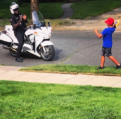 A motor officer with the Spokane (WA) Police Department was seen over the weekend playing a little game of catch with a young man, and the image posted to social media quickly drew dozens of comments of appreciation from local citizens.