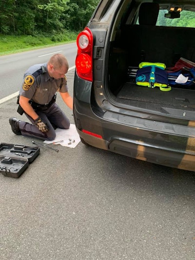 An officer with the Virginia State Police received some gratitude from a stranded motorist after he changed the left rear tire of her minivan.