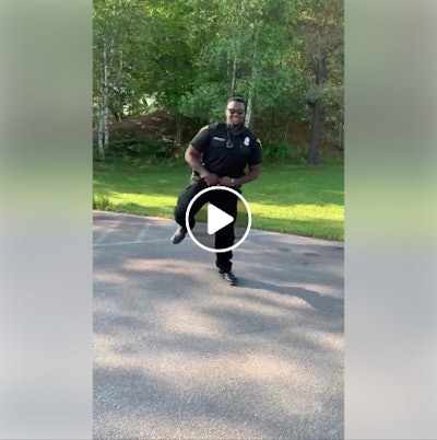 Officer Eze VanBuckley participating in the 'Get Up Challenge,' which involves a specific choreography of dance moves set to a song by Blanco Brown.