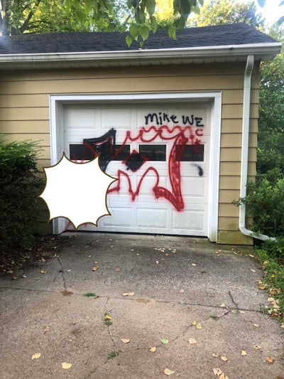 An officer with the Baraboo (WI) Police Department took it upon himself to help a 73-year-old man cover over graffiti painted across a garage door on Wednesday.