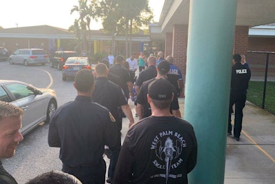 Officers with the West Palm Beach (FL) Police Department took time on Monday to escort the son of a colleague who succumbed to cancer last year to his first day of Kindergarten.