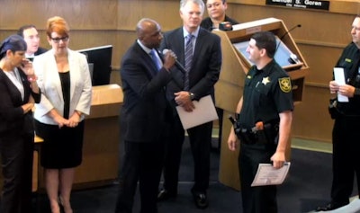 Tamarac, FL, city commissioner Mike Gelin, berates Deputy Joshua Gallardo during a 'Deputy of the Year' ceremony. (Photo: Tamara City Commission)