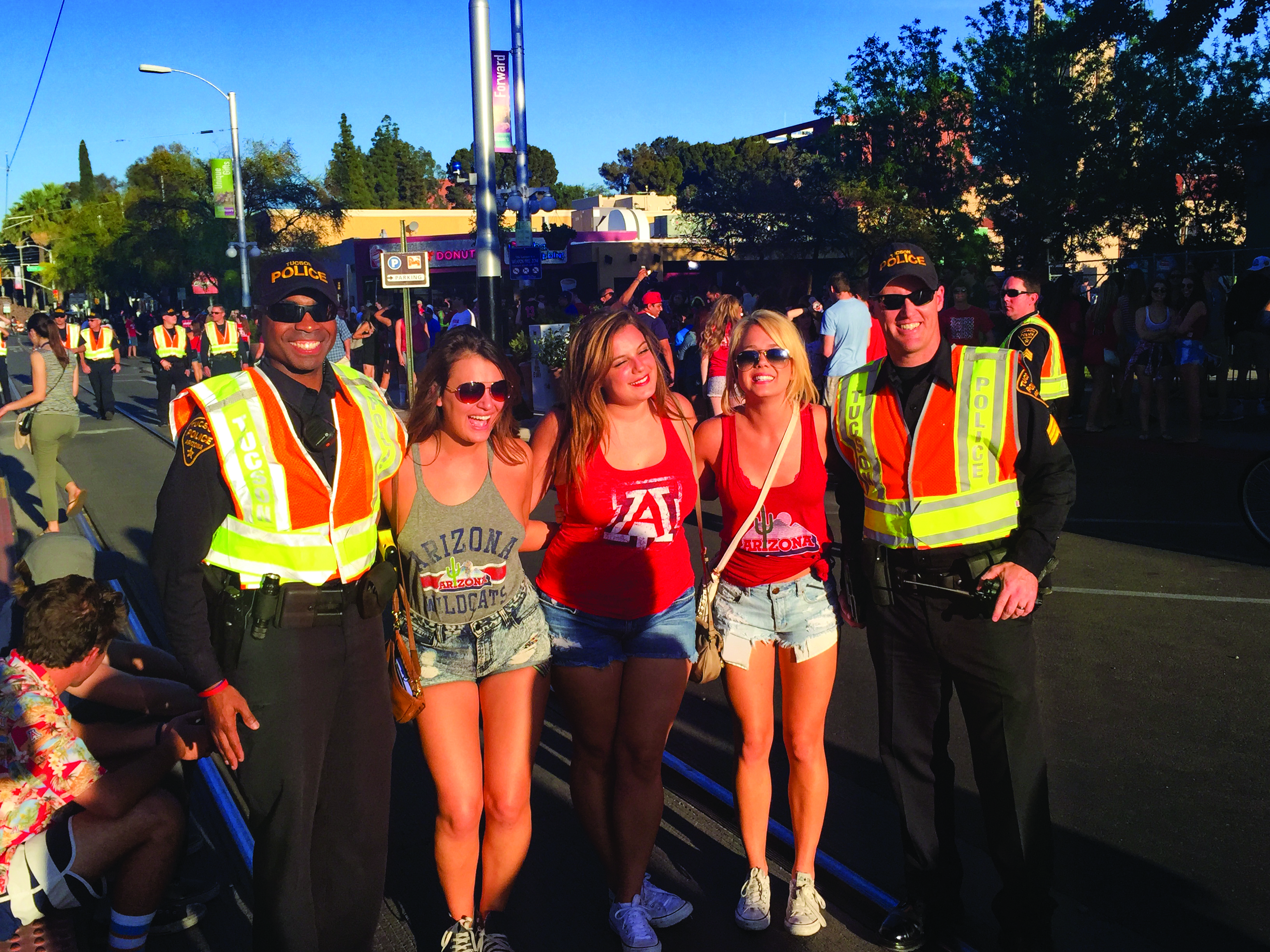 Officers pose for photos with fans, offer up bottles of water during outdoor events, and occasionally hand out swag.
