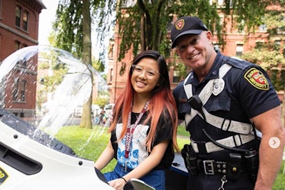 When Crystal Wang was three years old, she was photographed with Officer Charles Marren of the Harvard Police Department on the Harvard campus. Some 15 years later as a member of the Class of 2023, the two were reunited and recreated the image.
