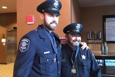 Officer Adam Miller, left, and Officer Rey Rivera were honored Apr. 29 for their actions during a mass shooting in February. Both have now returned to full duty after recovering from their wounds.