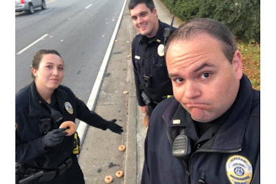 Officers with the Brookhaven (GA) Police Department were called when a citizen reported that a Krispy Kreme donut delivery truck had mistakenly ejected a number of glazed donuts on the side of the road.