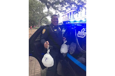 An officer with the Tallahassee Police Department delivers holiday turkeys to families in need. Image courtesy of Tallahassee PD / Facebook.