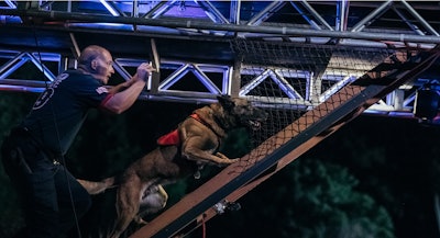 A K-9 team navigates the challenging Fire Escape. 'America's Top Dog' worked with some of the top K-9 units in the country as well as certified training organizations during the casting process. (Photo: A&E)