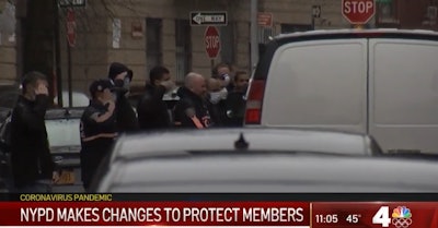 NYPD officers pay their respects to Detective Cedric Dixon who died Saturday of COVID-19 complications. (Photo: NBC News Screen Shot)