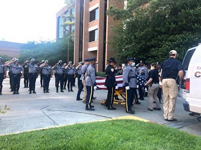 Baton Rouge police officers pay tribute to a slain comrade. (Photo: Our Lady of the Lake Regional Medical Center/Facebook)