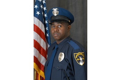 Det. Mikiel Smith was shot and wounded during a gunfight with a suspect outside of a restaurant.
