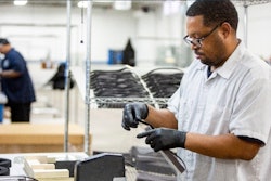 Ford worker assembles a face shield. (Photo: Ford)