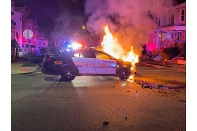 A Paterson, NJ, police vehicle burns after it was hit by the vehicle of a drug suspect during a pursuit. No major injuries were reported. (Photo: Paterson PD)