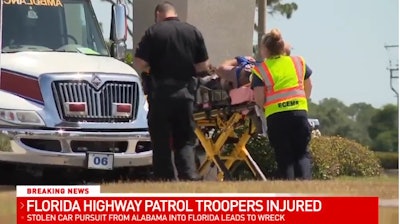 An injured Florida trooper had to be extricated from a vehicle after a pursuit crash Tuesday. (Photo: WEAR Screen Shot)