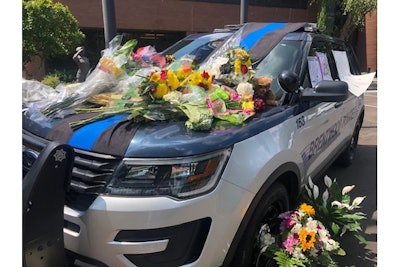 A candlelight vigil was held over the weekend for Officer Legieza, and citizens from the community have left flowers and memorials on a squad car parked in front of the police station in the days following his death.