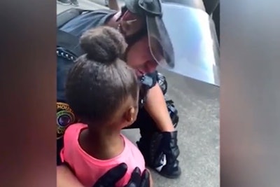 An officer with the Houston Police Department was captured on cell phone video comforting a 5-year-old girl during a protest last week.
