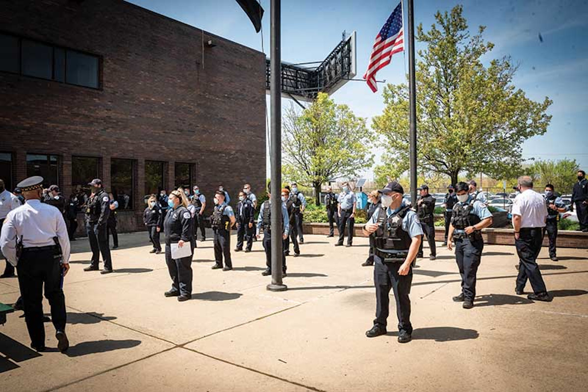 During the COVID-19 pandemic the Chicago Police Department held some of its daily briefings outside.