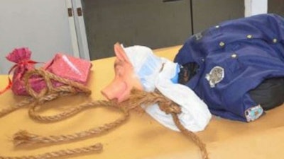 A mock lynching of a mannequin wearing a police officer’s uniform and a pig mask has been found hanging over an overpass on I-95 near Jacksonville, FL, over the weekend. (Photo: Jacksonville SO)